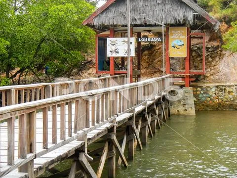 Wooden jetty with welcome sign on Rinca island, Komodo National Park, Nusa Te Stock Photos