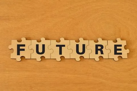 Wooden jigsaw puzzle with text FUTURE. Goals concept. Stock Photos