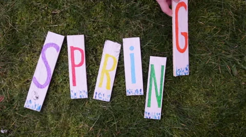 Wooden letters SPRING on the grass Stock Footage 47414816