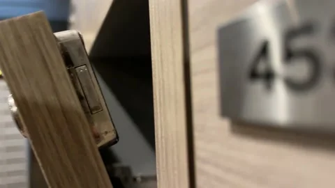 Wooden mailboxes close automatically slowly with blurred rows of mailboxes Video stock 230095734