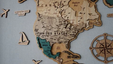 A wooden map elegantly shows North America and the world Stock Footage 307933286