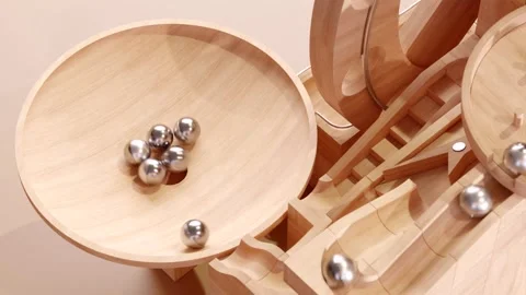 Wooden marble run machine. Rolling ball sculpture. Marble race toy. Stock Footage 256040995