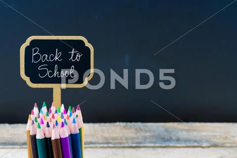 Wooden mini blackboard label with message Back To School Stock Photos