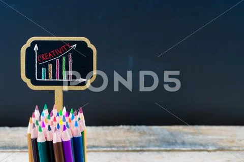 Wooden mini blackboard label with message Creativity Stock Photos