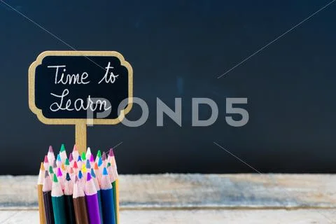 Wooden mini blackboard label with message Time To Learn Stock Photos