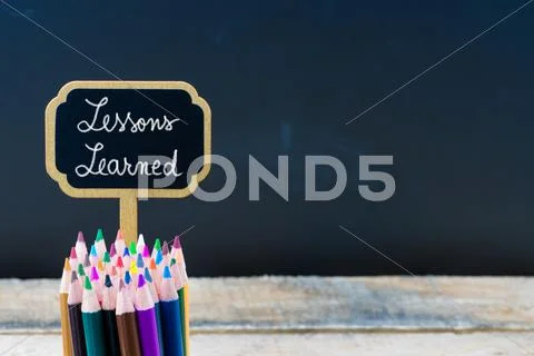 Wooden mini blackboard label with message Lessons Learned Stock Photos