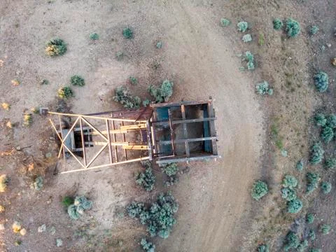 Wooden mining structure head frame on claim in the Nevada desert top down vie Stock Photos