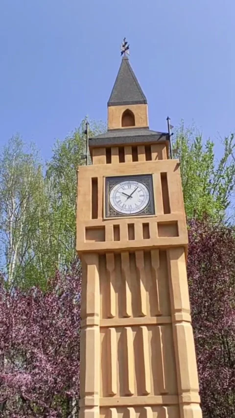 Wooden model of Big Ben clock tower with trees in the background Stock Footage 272227391