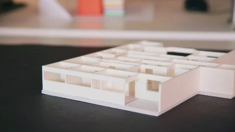 Wooden Model of Building Concept Sits on Architects Black Desk in Office, Stock Footage 140585641