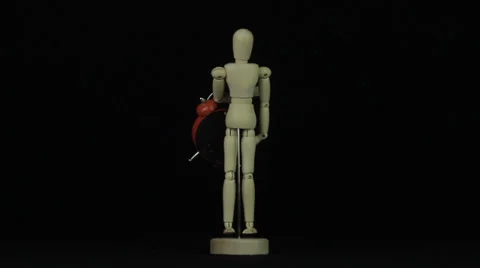 Wooden model of human rotates with clock loop Stock Footage 34660473