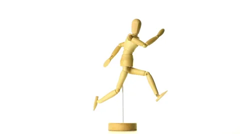 Wooden model of a running man loop Stock Footage 30578185