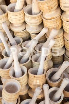 Wooden mortars and pestles as a kitchenware Stock Photos