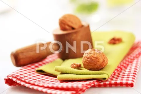 Wooden nutcracker and table linens Stock Photos