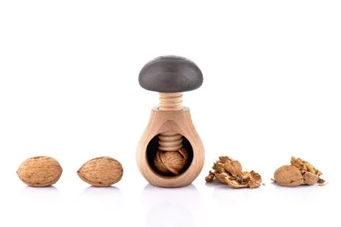 Wooden nutcracker and walnuts Stock Photos