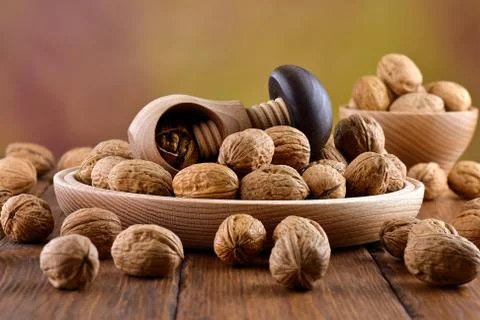 Wooden nutcracker and walnuts Stock Photos