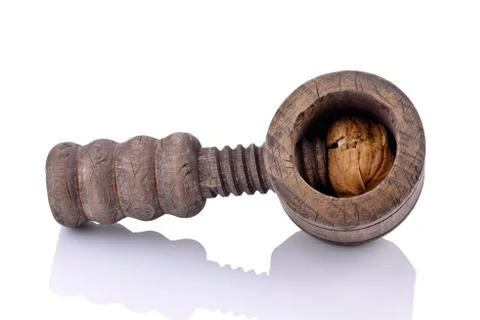 Wooden nutcracker and walnuts Stock Photos