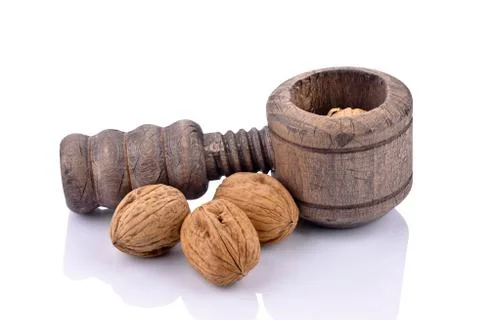 Wooden nutcracker and walnuts Stock Photos