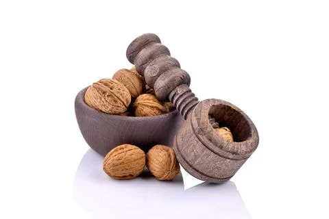 Wooden nutcracker and walnuts Stock Photos