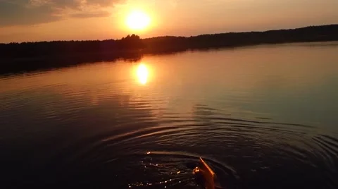 Wooden oars at sunset Stock Footage 54719779