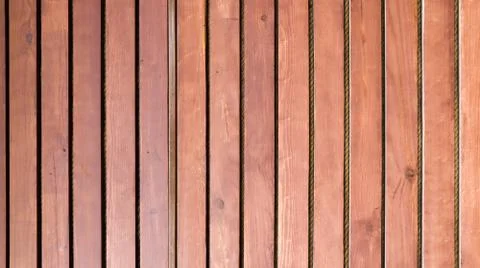 Wooden old brown vertical railing on the whole background. 写真素材
