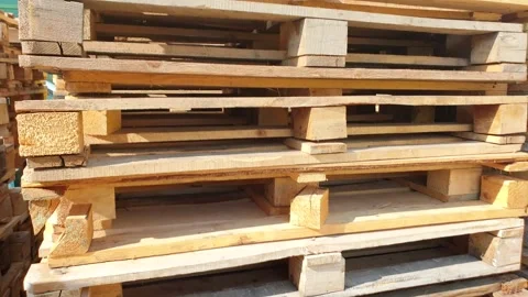 Wooden pallets.Stack of wooden pallets. Stacked industrial pallets made of wood. Stock Footage 244594971