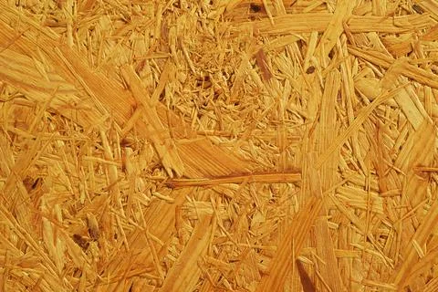 Wooden panel background, oriented strand board - OSB wood. Loft board. Stock Photos