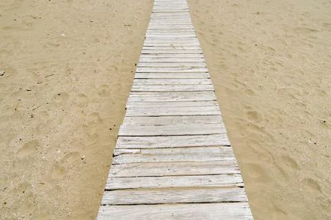 Wooden path on the beach. Stock Illustration