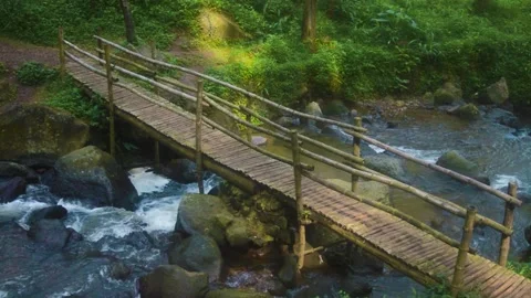Wooden pathway over stream in Java mountain landscape Vídeo Stock 340057975