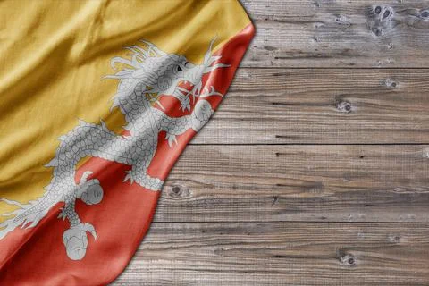 Wooden pattern old nature table board with Bhutan flag Stock Photos