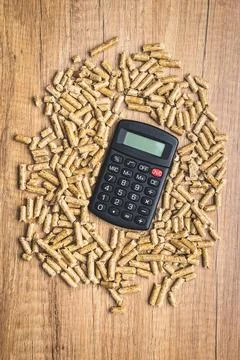 Wooden pellets, biofuel on a wooden table. Ecologic fuel made from biomass an Stock Photos