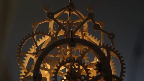 Wooden Pendulum Clock Backlit Stock Footage 121942423