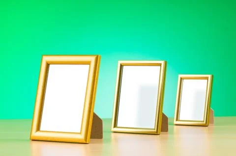 Wooden picture frames on the gradient background Stock Photos