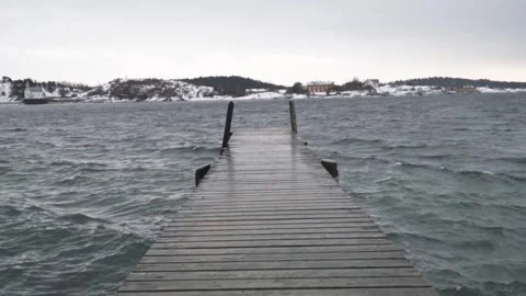 A wooden pier in a cold environment Stock Footage 243574155