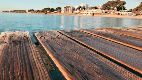 Wooden pier in sea. Majorca, Muro beach, Spain Stock Footage