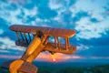 The wooden plane against the background of a sunset Photo