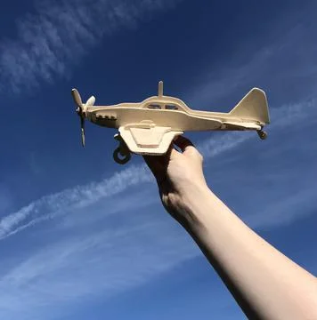 Wooden plane on the sky background Stock Photos