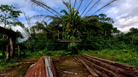 A wooden platform that can be used to cross the river through the metal cable Видео 336933766
