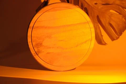 Wooden podium in the light of a sunset lamp Stock Photos