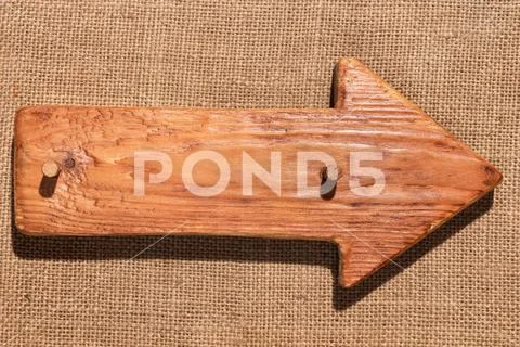 Wooden pointer made of light wood with wooden gag and with a place for your t Stock Photos