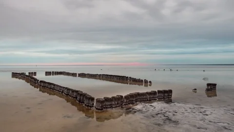 Wooden pool in front of Sunset clouds reflected in the smooth water of the lake Stock Footage 108208018