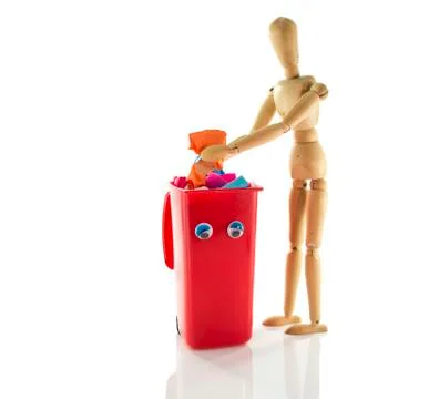 Wooden puppet with garbage bin container Stock Photos