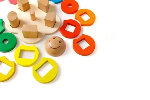 Wooden puzzle toy that develops logic and fine motor skills for preschool age Stock Photos