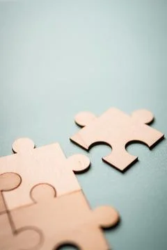 Wooden puzzles jigsaw solving problems in business. Innovation and teamwork i 写真素材