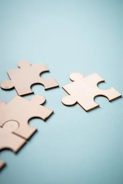 Wooden puzzles jigsaw solving problems in business. Innovation and teamwork i 写真素材