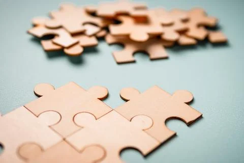 Wooden puzzles jigsaw solving problems in business. Innovation and teamwork i 写真素材