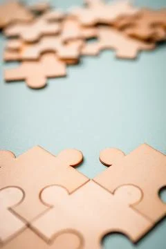 Wooden puzzles jigsaw solving problems in business. Innovation and teamwork i 写真素材