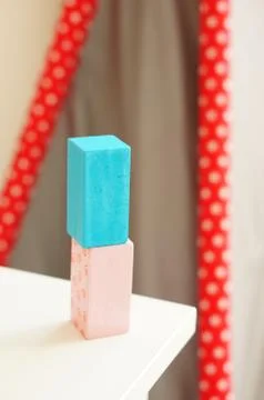 Wooden rectangular block stacked on top of the other on a white table Foto stock