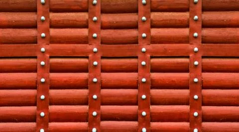 Wooden red pattern made of horizontal logs wall vertical green stripes Stock Photos