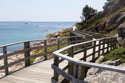 Wooden road near the sea Stock Photos