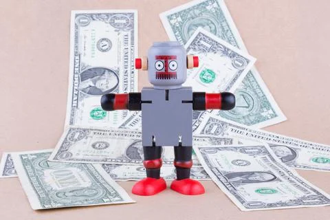 Wooden robot with banknotes Stock Photos